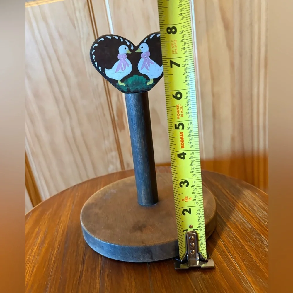 Vintage-style handmade wooden toilet tissue holder with painted geese